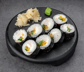 Large nori roll with shrimp and greens. Hearty seaweed cylinders pack shrimp, herbs, and crisp vegetables for a filling bite.