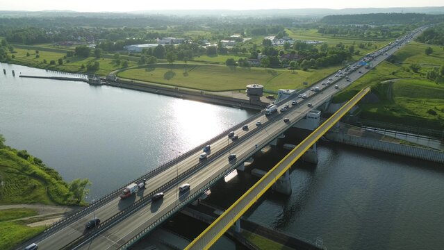 Scenic road bridge above blue river - Powered by Adobe