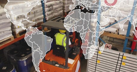 Operating forklift driver in yellow vest, hard hat navigating warehouse with pallets, drums, board