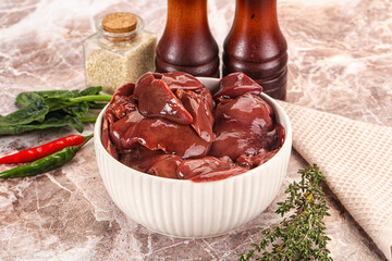 Raw uncokked chicken liver in the bowl