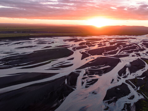 Aerial drone view of braided river at sunset, Iceland