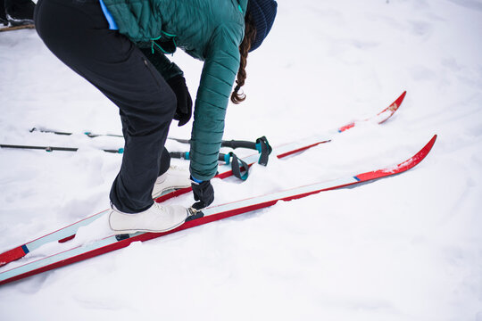 Woman happily cross country skiing in winter