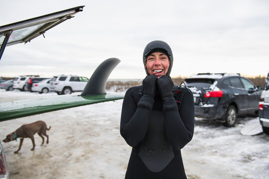 Woman after a winter surf being goofy