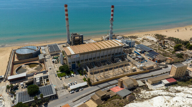 Aerial view of an Enel power plant along the Sicilian coast. Porto Empedocle, Italy - November, 2025