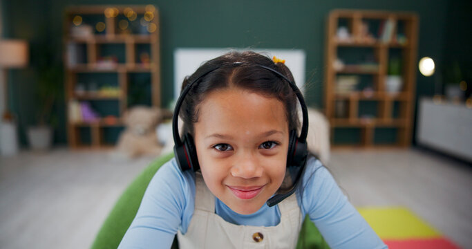 Headset, elearning and portrait of child in home for study, internet tutorial or virtual lesson. Face, remote education and girl with mic for homeschool, course or student in online class with POV