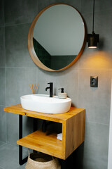 Modern bathroom interior design with wood vanity and mirror