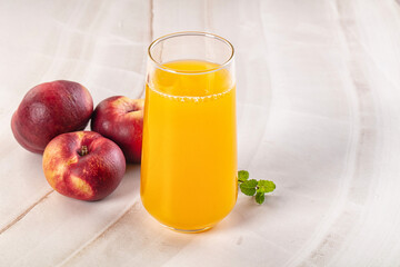 Fototapeta premium Vitamin beverage - peach juice glass