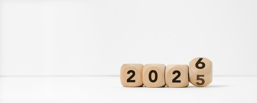 Wooden blocks transitioning from 2025 to 2026 on a clean white background. Concepts of a new year beginning, goal setting, planning, transition, change, and future opportunities.