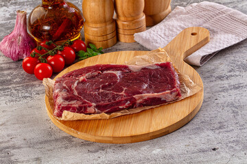 Gourmet raw rib eye steak
