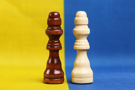 Chess figures on the background of the flag of the USA. The concept of talks in Ukraine