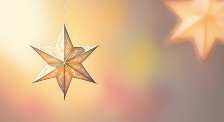Obraz premium Hanging star ornament illuminated against a softly blurred background 