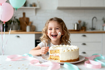 Little Girl Enjoying Birthday Cake, Cream on Face, Sitting at Table with Balloons and Ribbons, Soft Cozy Lighting, Warm Indoor Celebration Scene