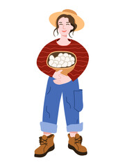 Vector illustration of a farmer woman in a hat, overalls and with a basket of fresh eggs, isolated on a white background.