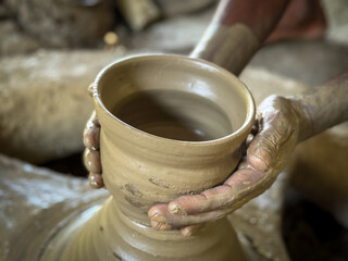 Close-Up of Traditional Pottery Making by Artisan Hands in Rural Bangladesh. Hands of a potter