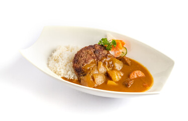 Japanese-style hamburger steak served with rich curry sauce and steamed rice, captured in clean food photography for menu use.