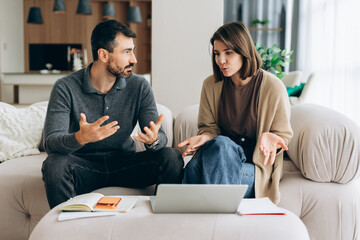 Couple discussing financial problems at home