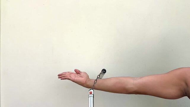 Close up a hand throwing nunchaku white background , slow motion video.