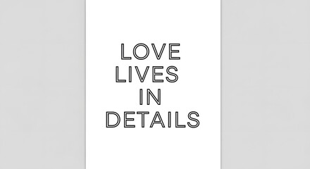 A minimalist design featuring the phrase 'Love Lives in Details' written in bold, black capital letters on a white background with subtle gray borders on each side