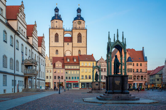 Market square with town church and old town hall during blue hour in Lutherstadt Wittenberg, Germany