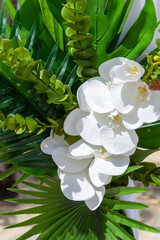 White orchids and silk drapes adorn a Caribbean wedding pagoda in a scene of pure tropical elegance