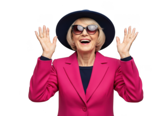 Joyful elderly woman wearing a stylish hat and sunglasses with arms raised in excitement isolated on transparent background