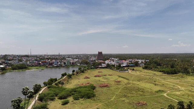 Beautiful aerial landscape of Tenkasi showing the temple gopuram, serene lake, and vibrant town set amid green fields and blue sky, highlighting rural South India&rsquo;s charm.