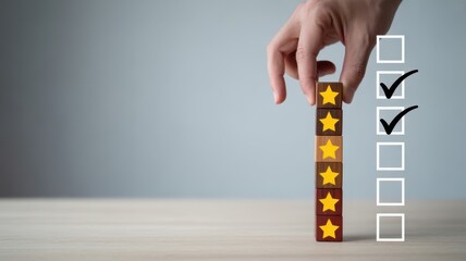 Review and Ranking: A hand meticulously places a star block on a vertical tower, signifying positive assessment and high ratings on a wooden surface.