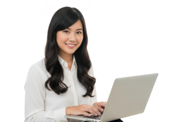 Smiling young woman with long dark hair wearing a white shirt typing on a modern silver laptop isolated on transparent background