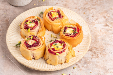 Delightful cranberry feta phyllo bites served on a decorative plate for a tasty appetizer