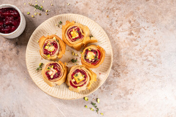 Delightful cranberry feta phyllo bites served on a decorative plate for a tasty appetizer