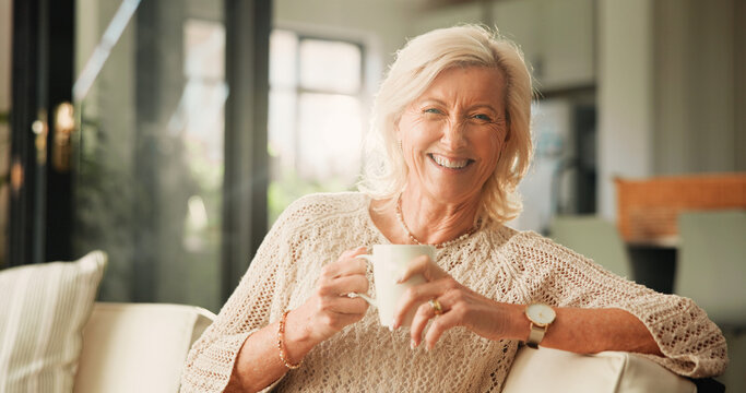 Fototapeta Happy, coffee and portrait of senior woman on sofa in home with relax in retirement in living room. Smile, tea and elderly female person drinking warm beverage in morning with rest, calm or peace.