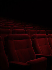 Obraz premium Empty Red Velvet Cinema Seats In Dramatic Low Light