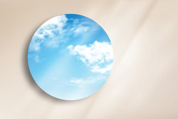 Minimal round mirror reflecting bright blue sky and clouds on beige wall background. Clean and modern composition ideal for product mockup, cosmetic display, branding, and design presentation.