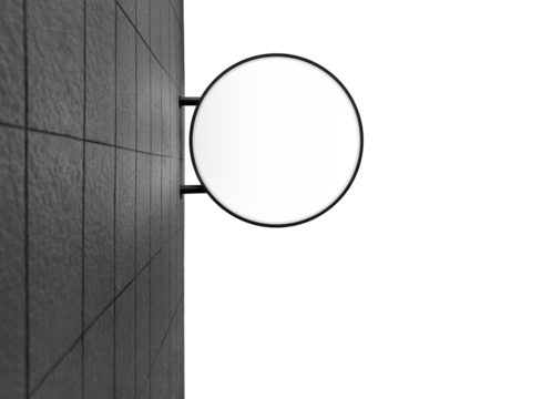 Wall mounted circular light box advertising sign with black tile wall isolated on white background