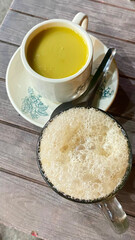 Photo of coffee and tea on a wooden table