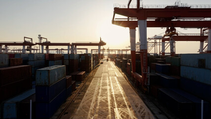 Unloading large cargo containers seaport. Loading freight sea port. Top aerial drone view. Lot big boxes rows, ship delivery ocean harbor. Industrial Shipping day. Goods export import. Marine dock.