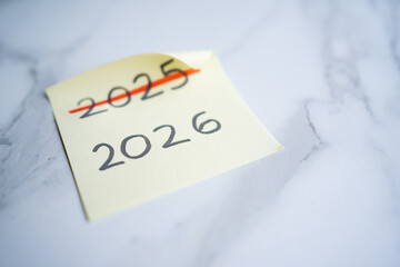 Planning future, changing 2025 to 2026 on sticky note