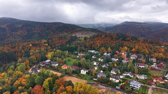 Vivid hillside hamlet surrounded by nature, Charming aerial view of seasonal village amidst lush countryside