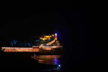 Illuminated Ancient City Wall at Night