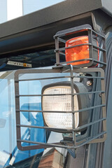 Construction compact loader headlight of new machinery close up view