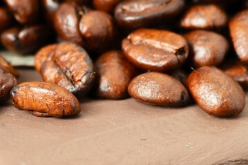 Detailed macro view of roasted coffee beans with rich brown hues