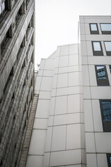 Obraz premium Modern and Historic Building Facades in Urban City Architecture