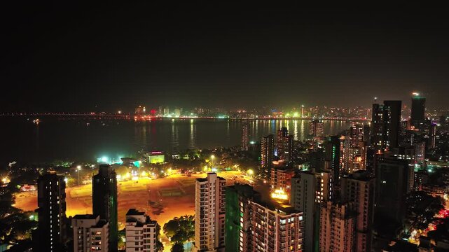 Aerial view of Mumbai city at night. Drone shots of the most iconic of South Bombay, Marine Drive, also known as The Queen's Necklace. Shot of Mumbai Skyline, high-rise buildings in South Mumbai.	
