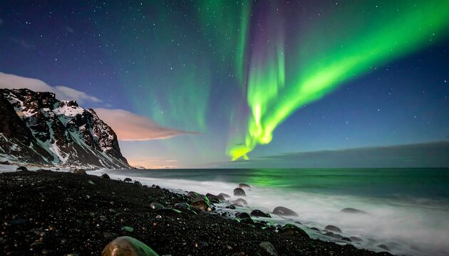 Vivid green and purple aurora borealis over a dark rocky beach with waves crashing - Powered by Adobe