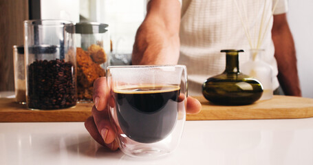 Serving, hand or person in cafe with coffee, presenting or intense brew in breakfast beverage. Hospitality, service or barista in espresso bar with cold blend, glass or handling of morning drink.