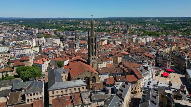 Basilique Saint-Michel-des-Lions and surrounding cityscape, Limoges, France. Aerial drone ascending and cityscape