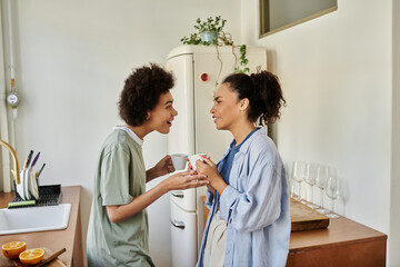 Happy couple sharing joy and laughter in their cozy modern apartment