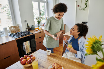 Happy couple enjoying breakfast together in a modern apartment filled with warmth