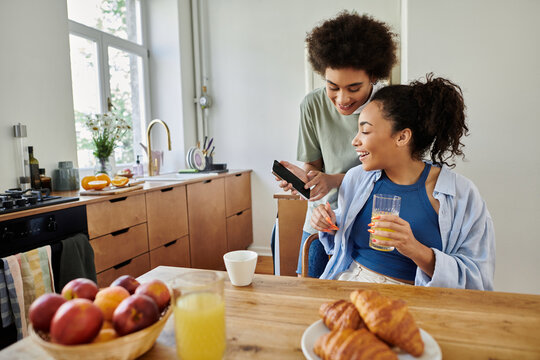 Happy African American couple enjoying quality time at home in their modern apartment