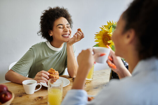 Happy couple enjoying a sunny morning together in their cozy apartment